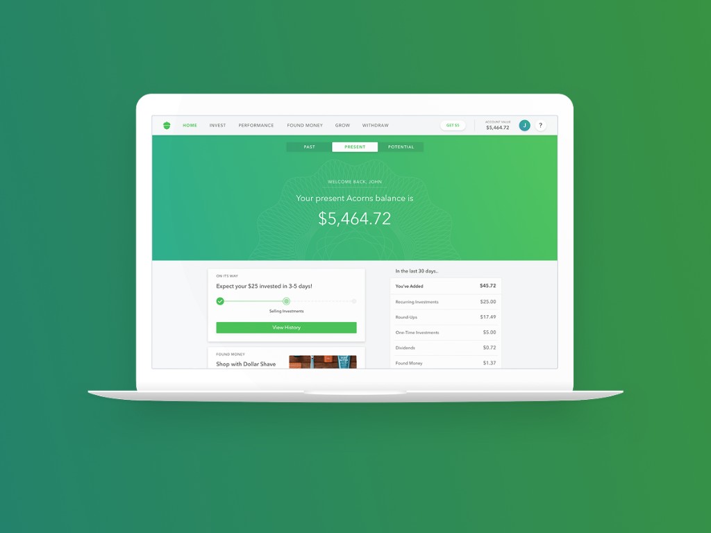 Acorns web dashboard on laptop showing account balance and activity